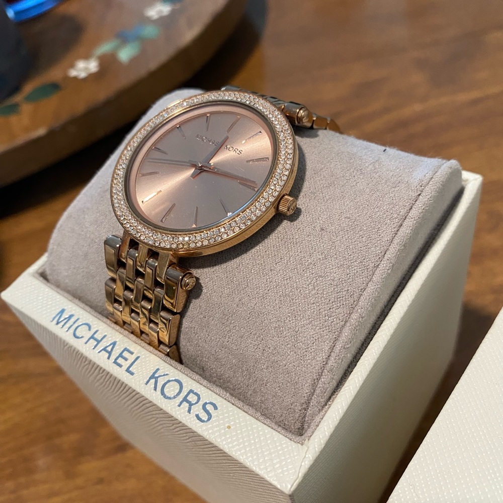 Like new Michael Kors rose gold watch with box and care instructions included.